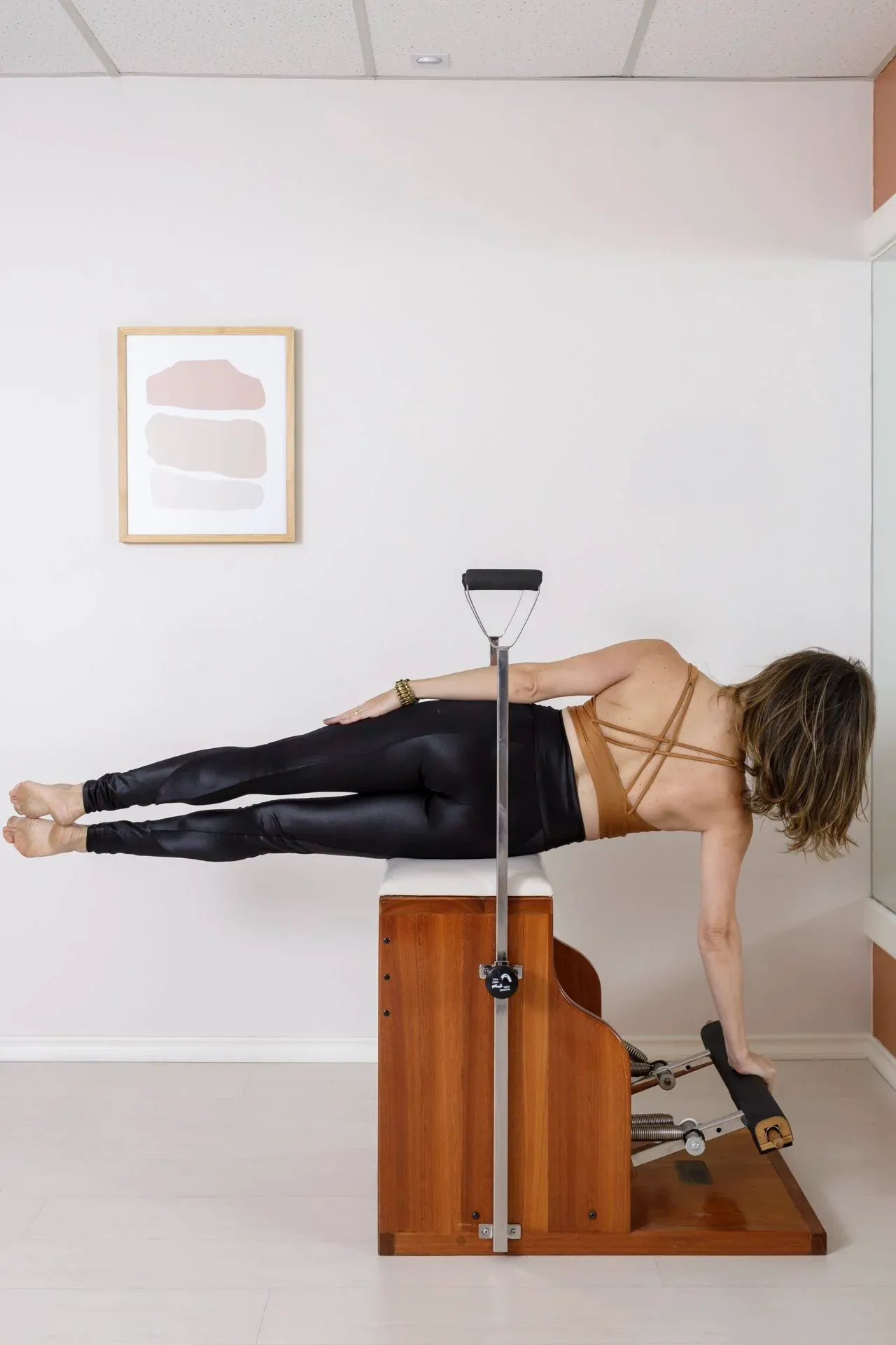 Aluna durante a prática de Pilates